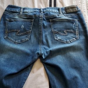 Silver distressed skinny jeans 34w 31L